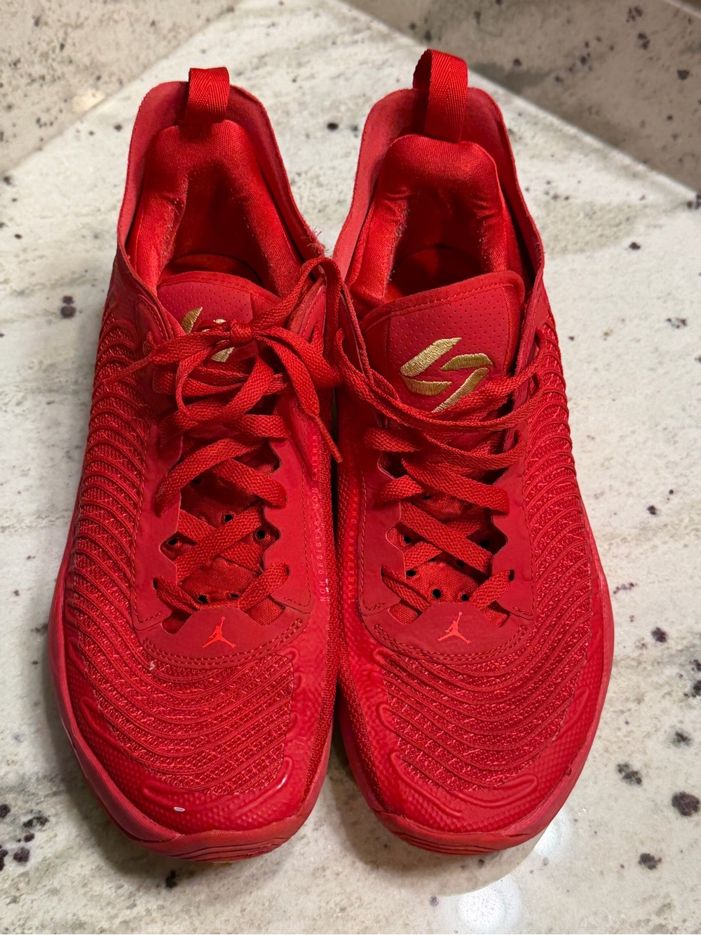 Jordan Women's Red Athletic Sneakers with Gold Accents